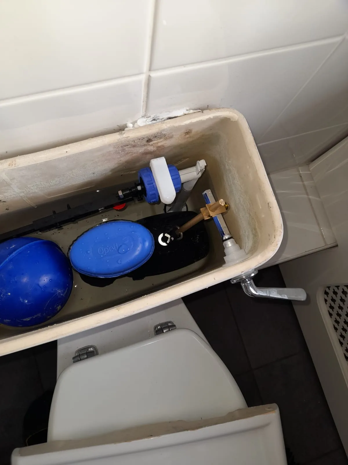 Toilet cistern stripped down with the fill valve serviced